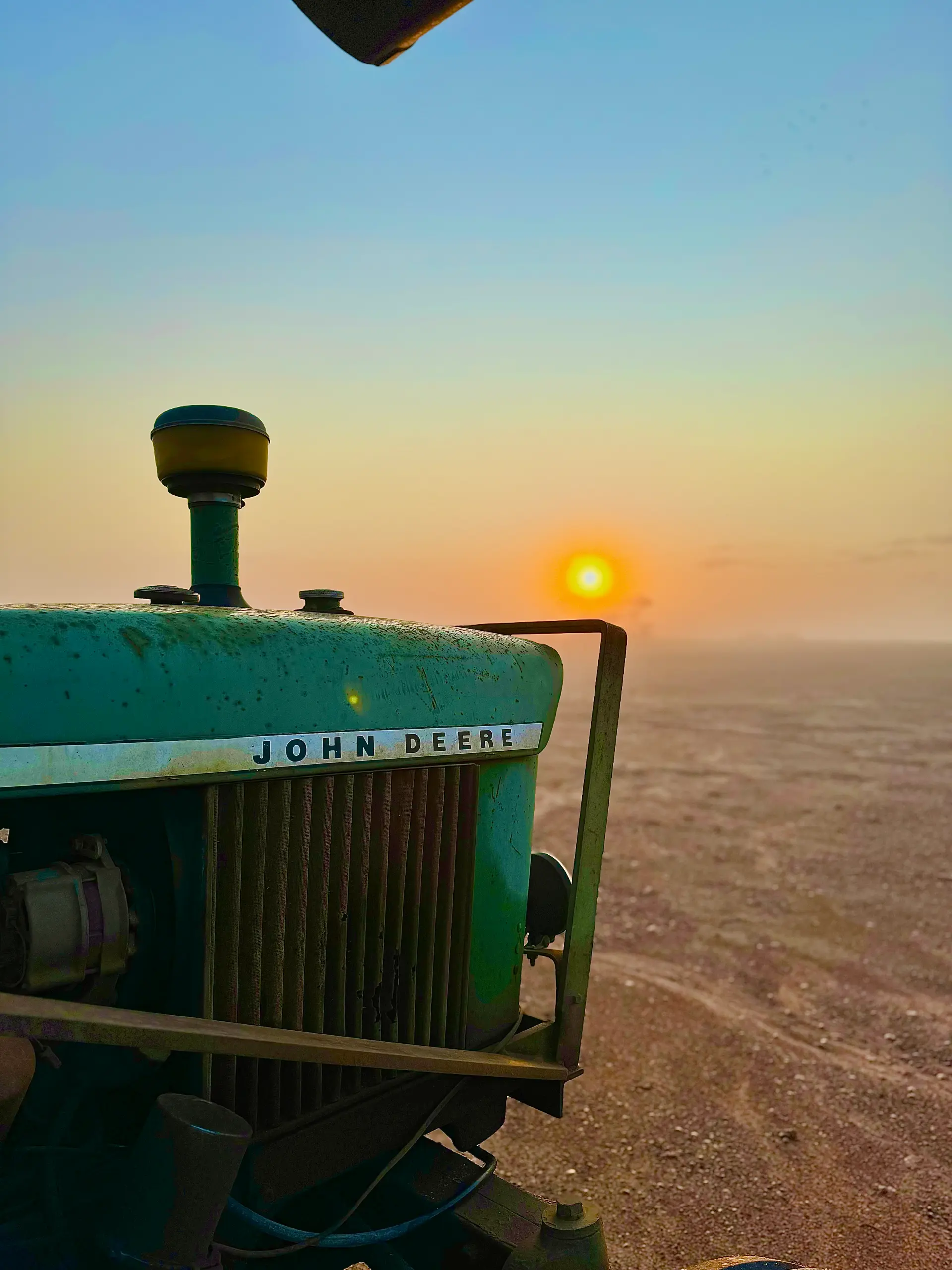 John Deere tractor at sunrise, Sunnydale Farms
